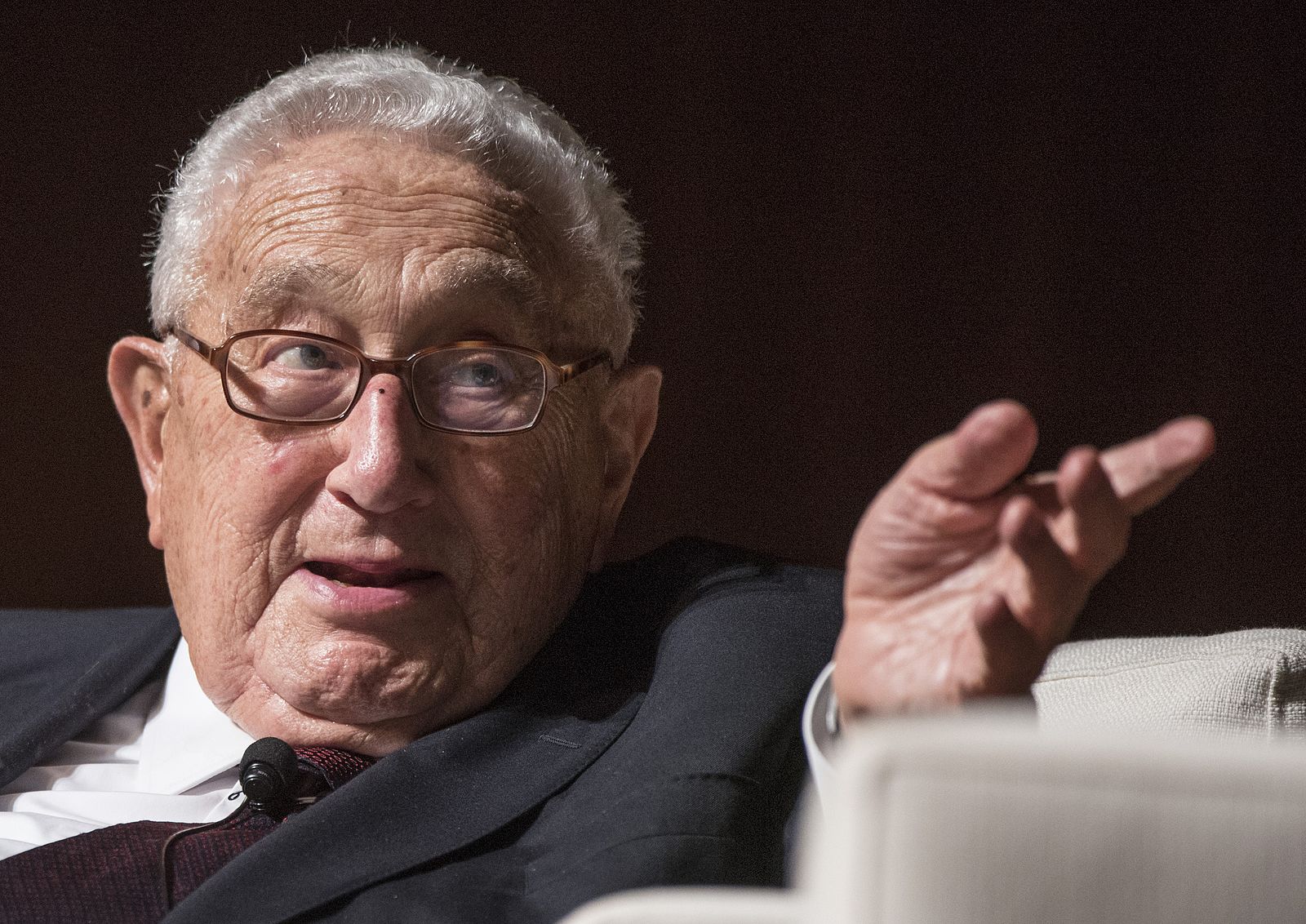 photo of Henry Kissinger making a point