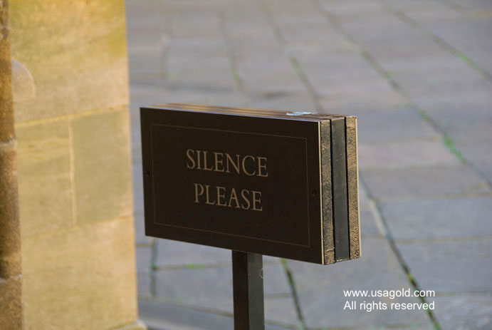 photo of library sign reading 'silence please'