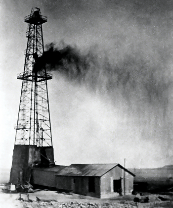 antique photo of Aramco's first oil well in Saudi Arabia