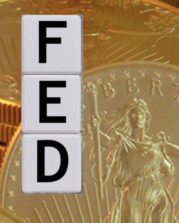 Image of the word "FED" with a gold coin in the background