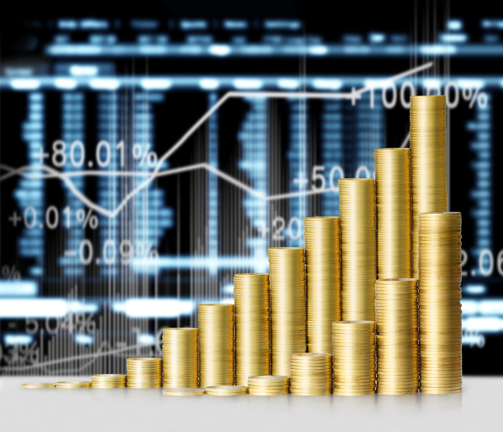 graphic illustration of gold coin stacks against a chart background