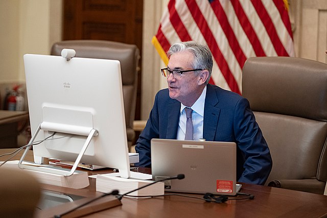 photgraph of Fed chairman Powell at computer screen