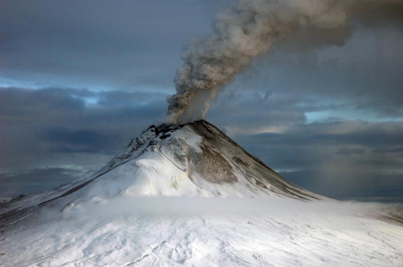photgraph of a volcano spewing smoke
